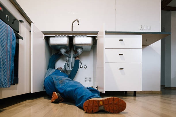 Professional Drain Cleaning technician working in Highland, MI